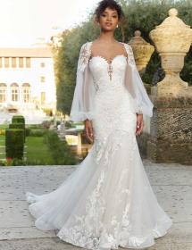 Model in an ostentatious royal garden wearing a wedding dress designed by Morilee style number 2475