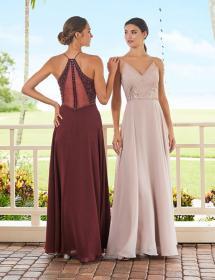 Two models, one showing the front, the other amazingly showing the back, are modeling a mothers dress by Adrianna Pappel style 40348 on a deck with greenery in the background.