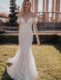 Plus size model wearing a beautiful wedding dress in front of a garden of cactus and palms.Plus size model wearing a beautiful wedding dress in front of roman ruins.